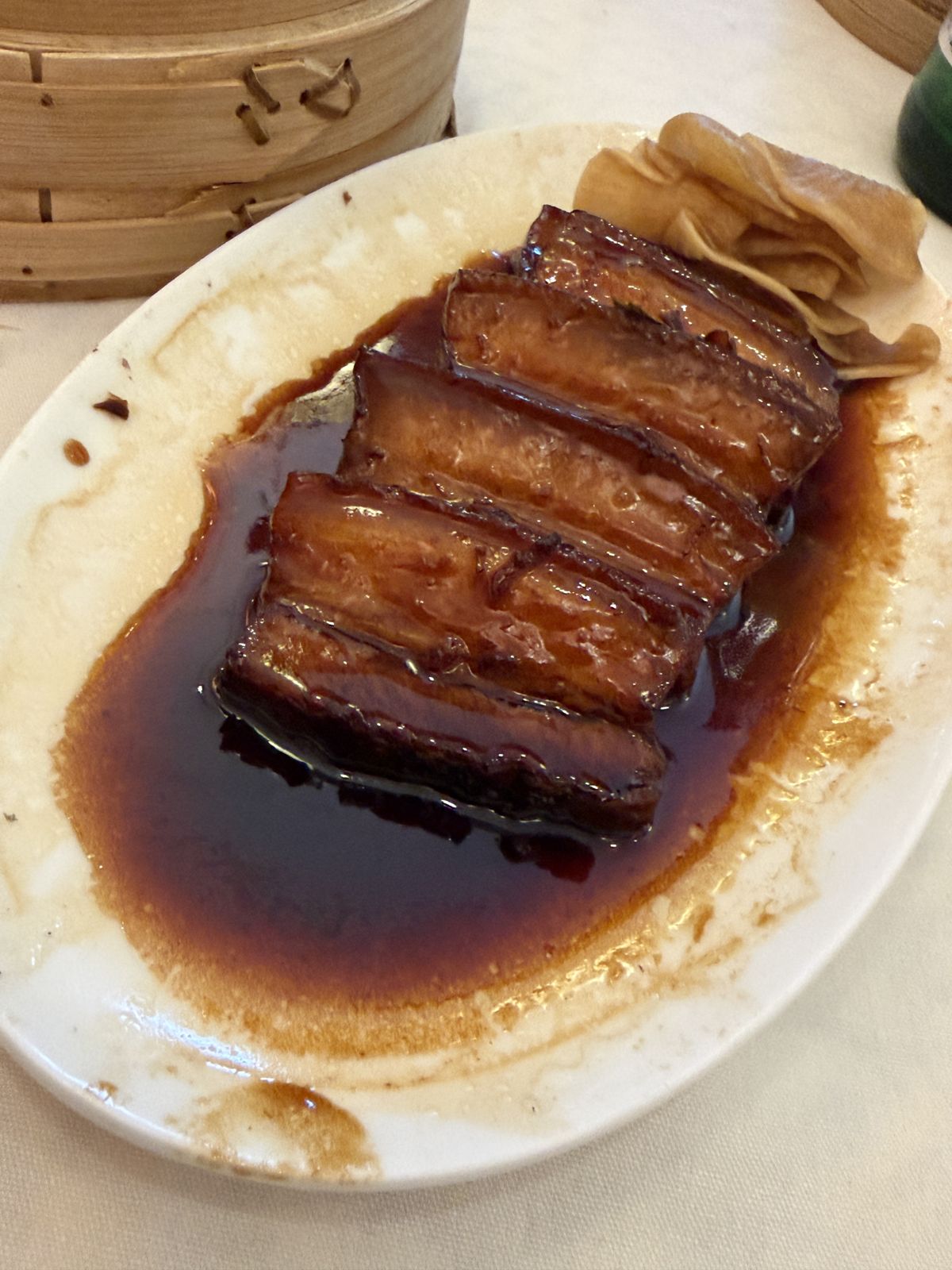 Braised pork belly slices in dark sauce with folded buns at HK Lounge Bistro