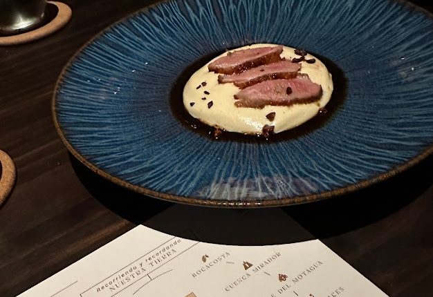 Sliced duck, with the Nuestra Tierra menu card