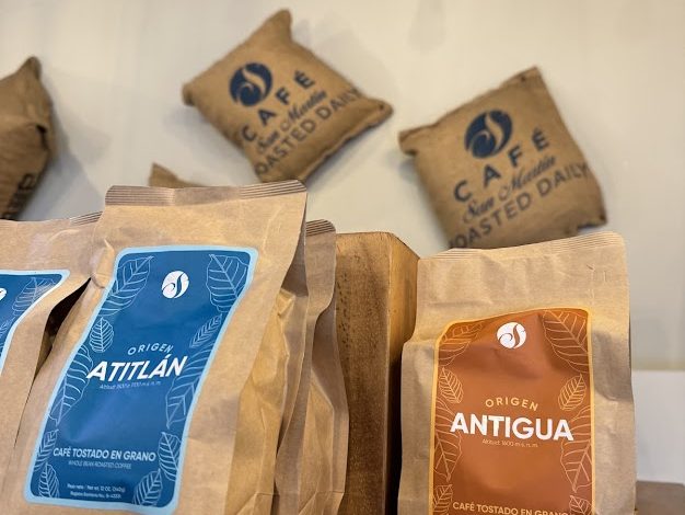 Café San Martín coffee bags on wooden shelves, burlap sacks on the wall